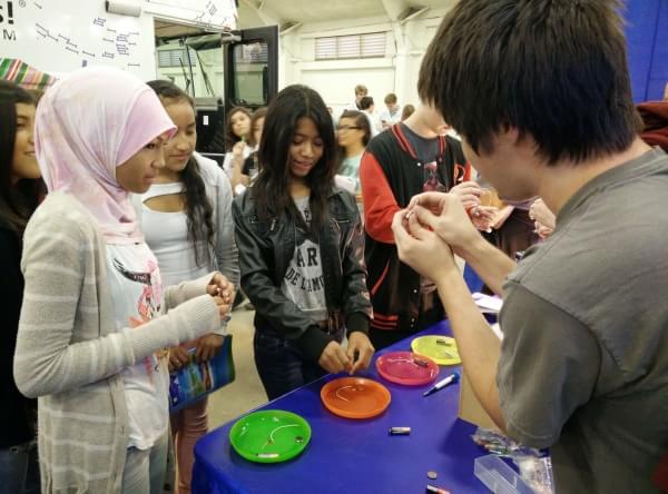 CER teaches High Tech Fair attendees how to build a motor